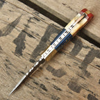 American flag folding knife blade close-up detail