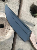 Walnut wood handle detail on black blade knife
