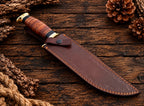 Copper Damascus Bowie knife on wood background - full length view