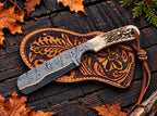 Stag horn handle detail on copper Damascus bull cutter knife