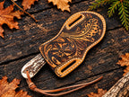 Hand-tooled floral leather sheath for copper Damascus bull cutter