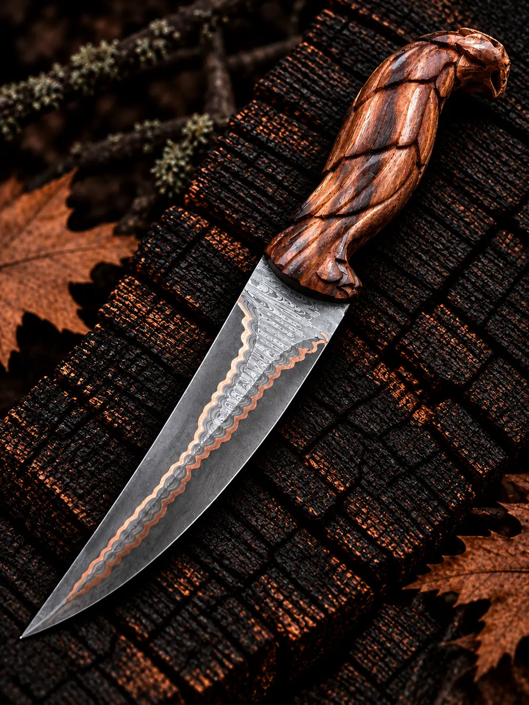 Handmade copper Damascus knife with ladder pattern blade and hand-carved eagle wood handle - full view