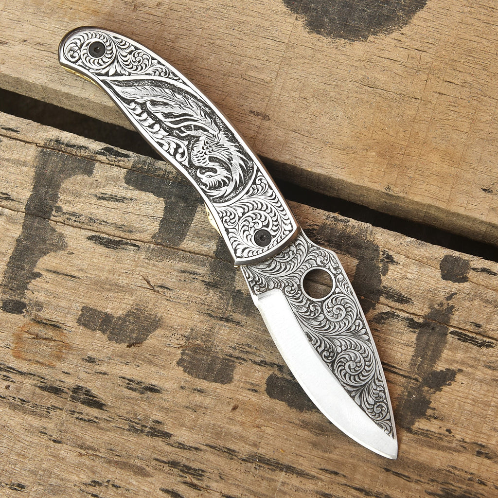 Custom engraved folding knife open, Damascus blade