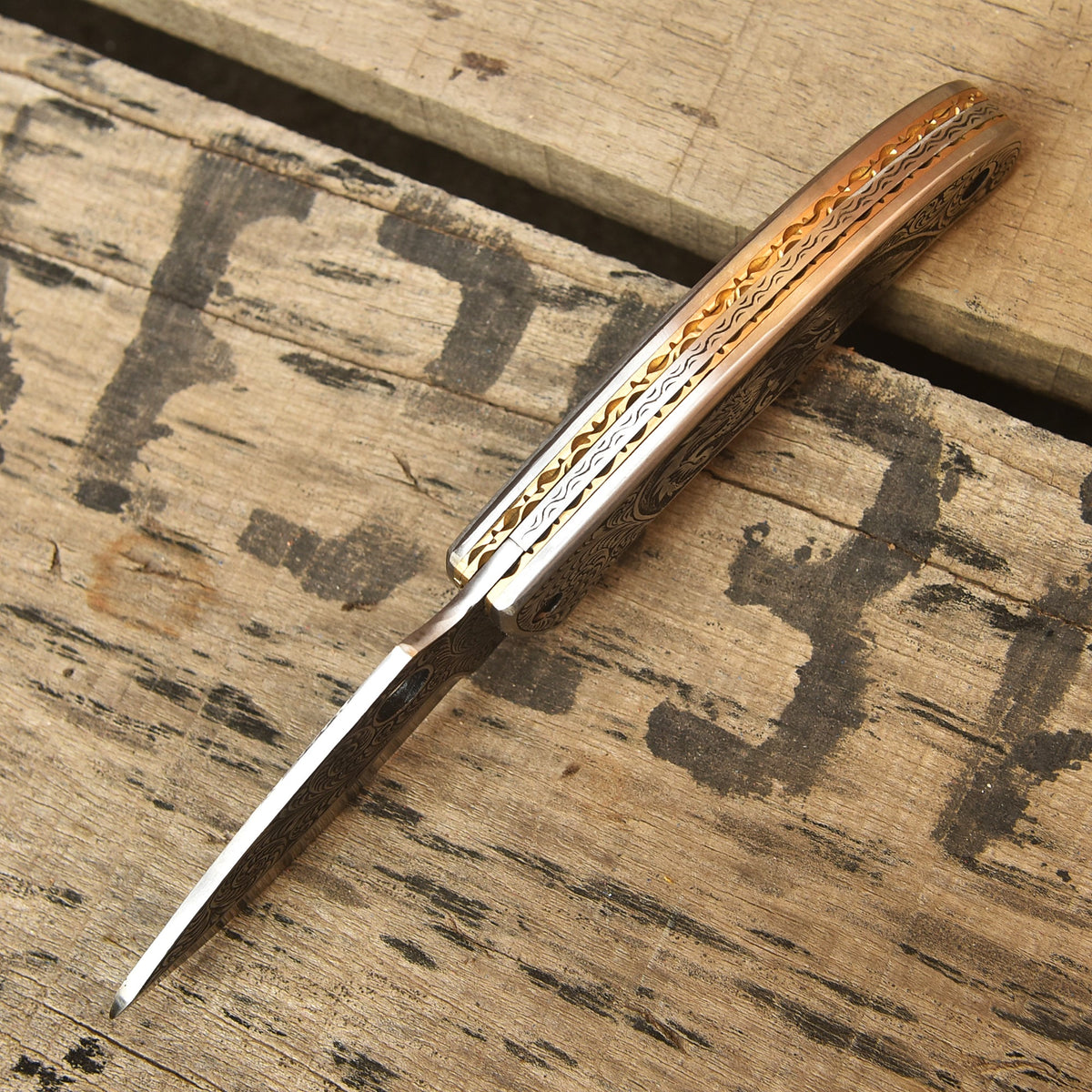 Custom engraved Damascus folding knife closed view