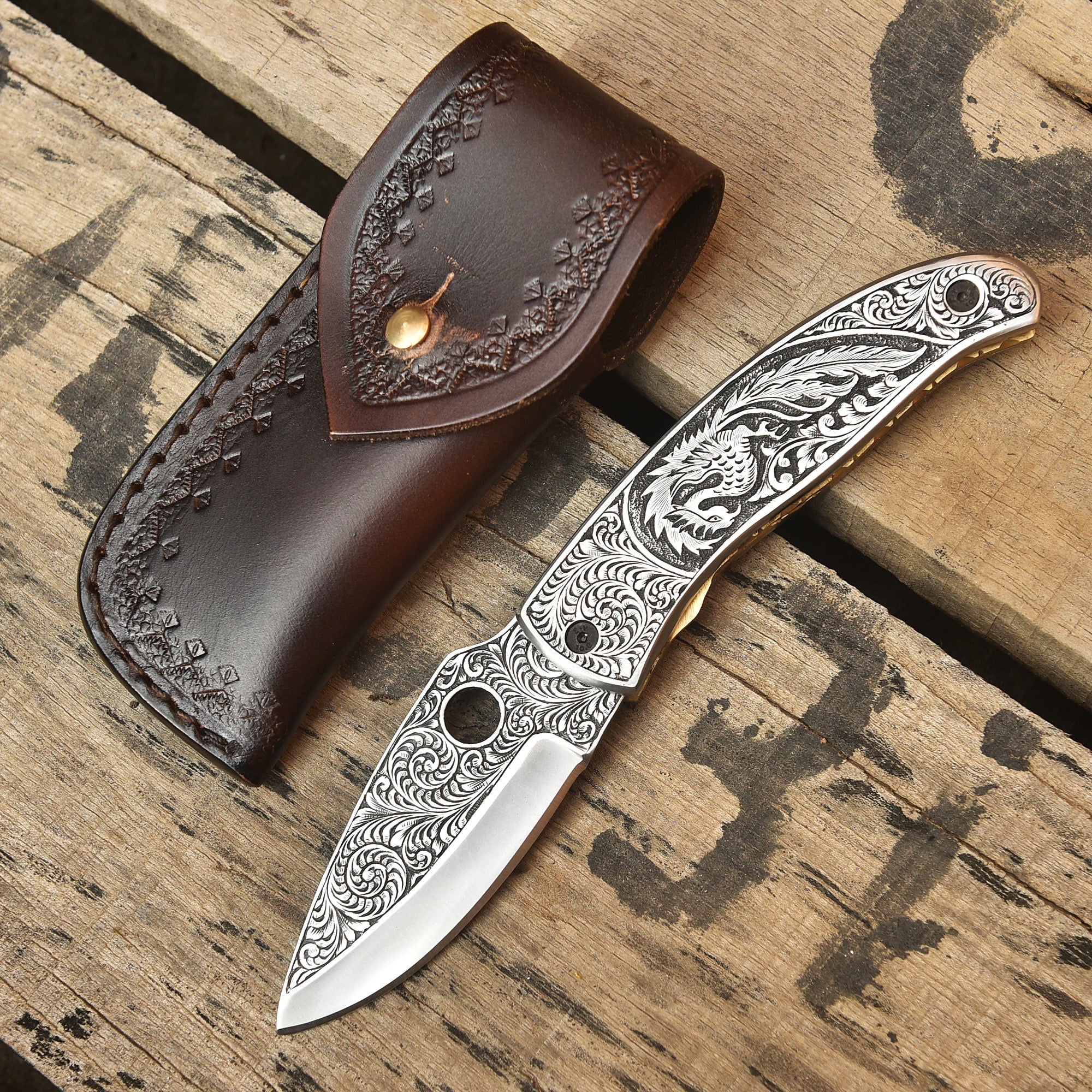 Custom engraved Damascus knife with leather sheath