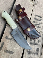 Acid wash D2 steel blade with fuller close-up on skinner knife