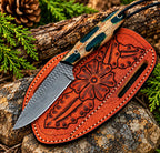 Handmade D2 steel cowboy knife with camo handle and tooled leather sheath - full view