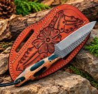 D2 steel cowboy knife with camo handle on rock background - side angle