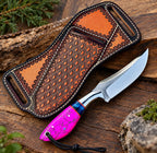 D2 steel drop point blade close-up on magenta crackle handle cowboy knife