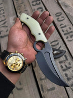 Finger hole and pale cream G10 handle with screws detail