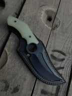 Black leather sheath with hair-on cowhide inlay for D2 steel finger hole knife