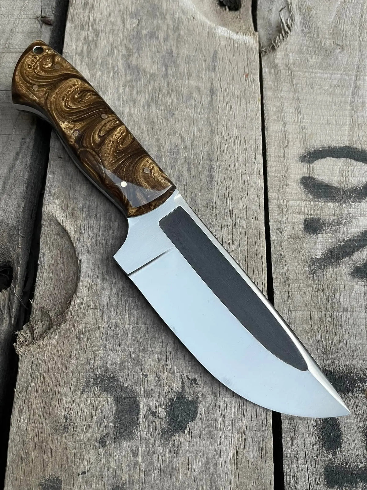 Satin polished D2 steel blade with fuller close-up on skinner knife
