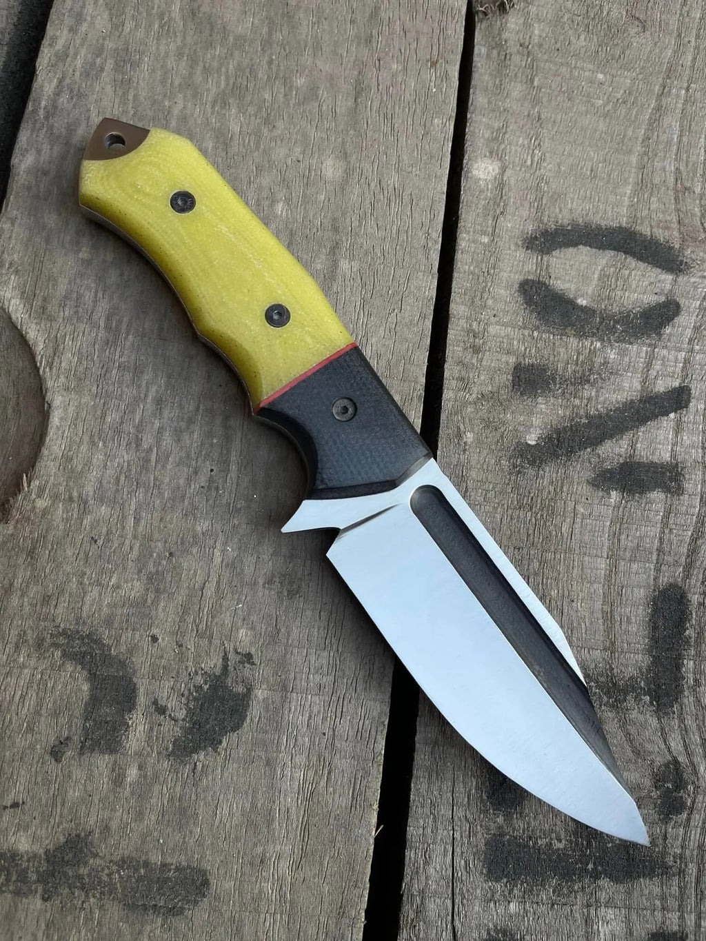 D2 steel blade with fuller close-up on skinner knife