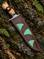 Damascus feather bowie knife with green resin wood handle and Italian leather sheath - angle 3