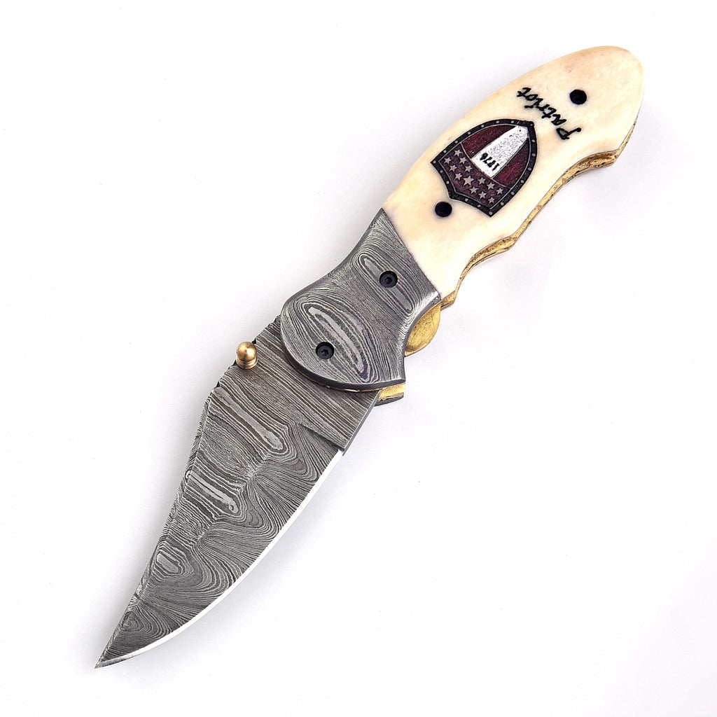 Close-up of Damascus steel folding knife blade pattern