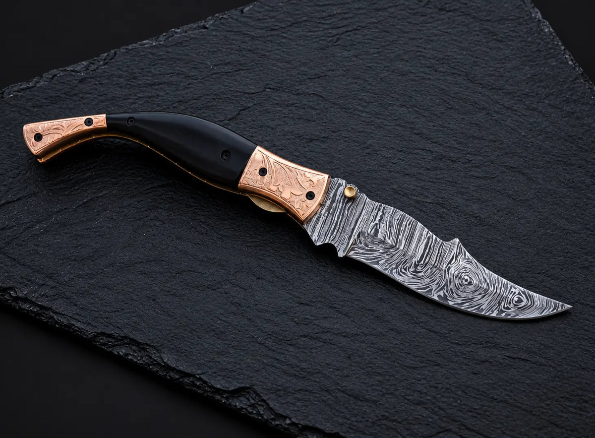 Damascus steel fire pattern blade close-up on folding knife