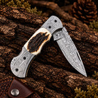Raindrop Damascus blade pattern close-up on folding knife