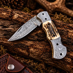 Damascus bolster detail on folding knife