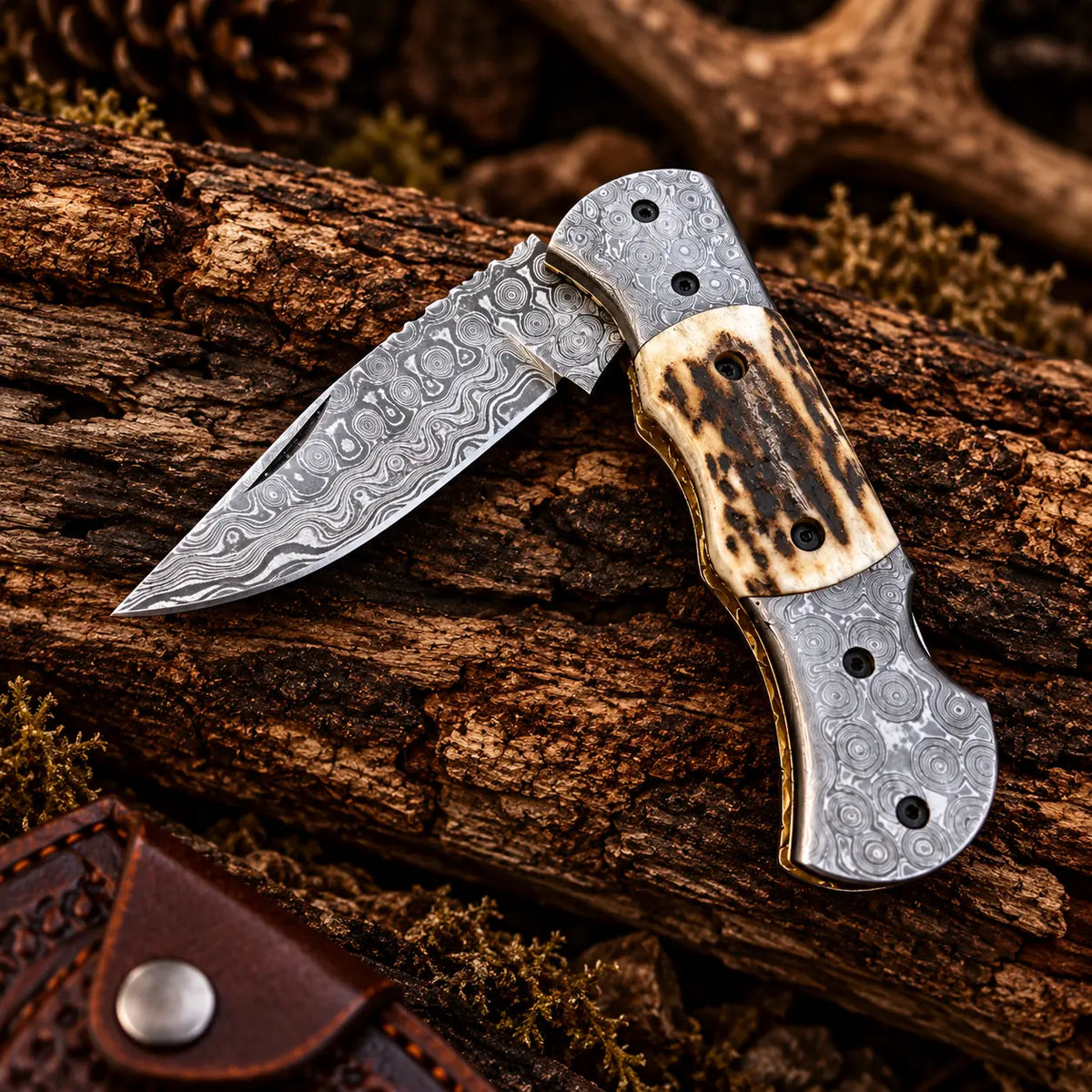 Damascus bolster detail on folding knife