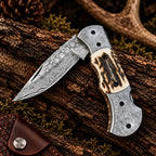 Damascus folding knife with genuine leather sheath