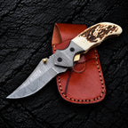 Handmade Damascus folding knife with stag horn handle, liner lock and Italian leather pouch - full view