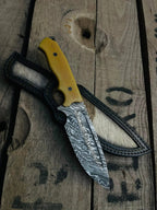 Fire pattern Damascus blade with fuller close-up on cowboy knife