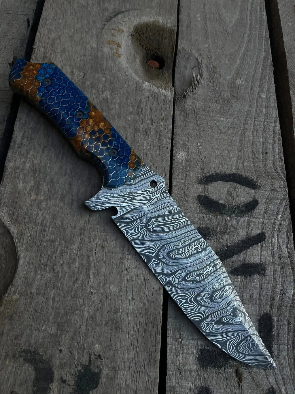 Honeycomb pattern blue and brown resin handle with screws detail