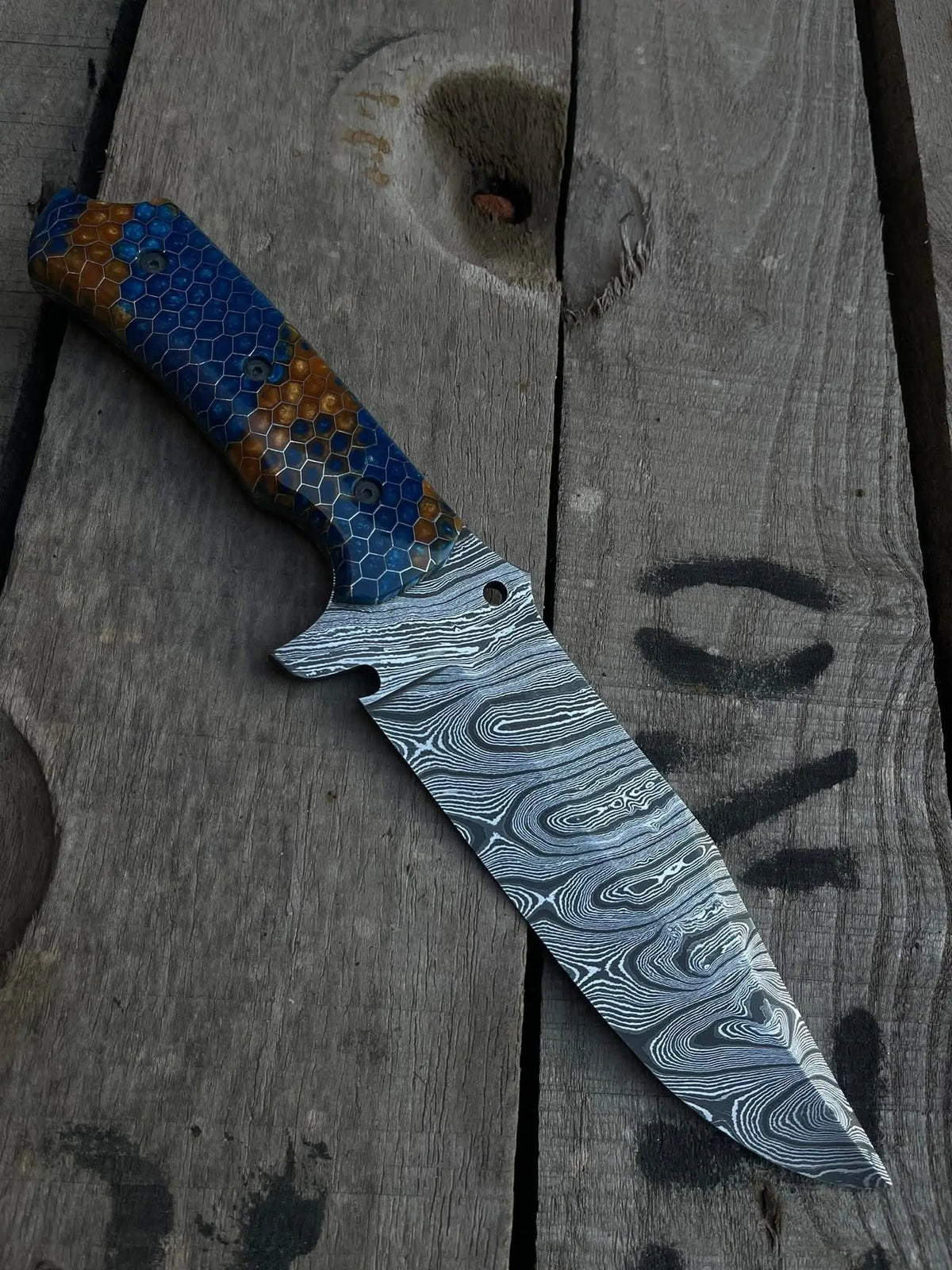 Honeycomb pattern blue and brown resin handle with screws detail