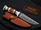 Damascus steel blade pattern close-up on hunting knife