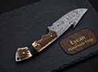 Feather Damascus blade pattern close-up on gut hook skinner knife
