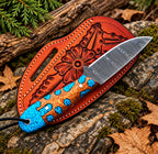 Crushed turquoise stone inlay handle detail on Damascus skinner knife
