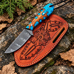 Damascus skinner knife with braided leather lanyard detail