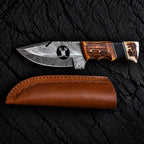 Handmade Damascus skinner knife with wire-cut deer head design and stag horn handle - full view with leather sheath