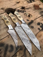 Damascus steel blade pattern close-up on 3-piece knife set