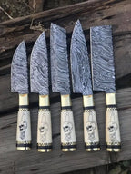Damascus steel blade pattern close-up on 5-piece knife set