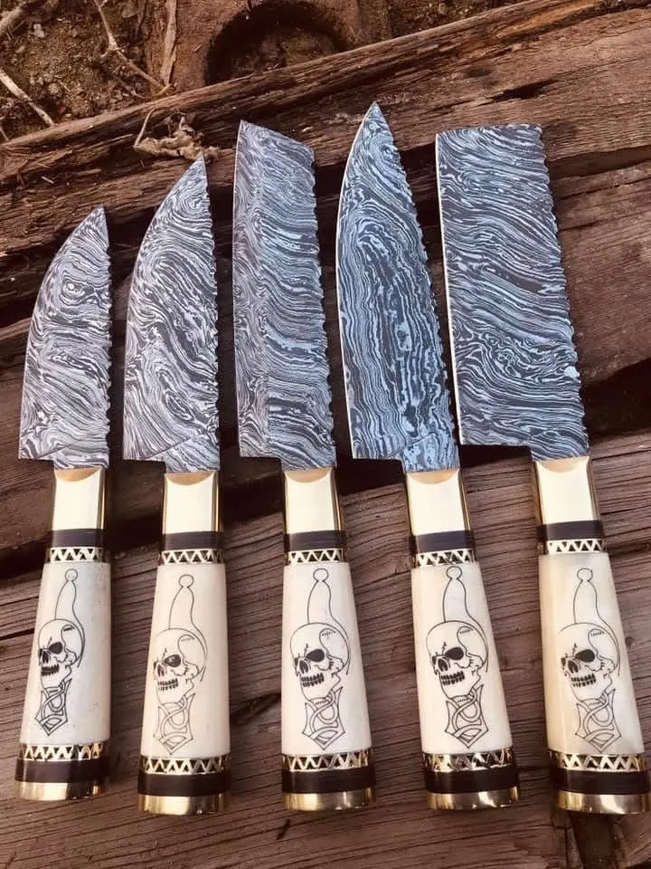 Brass bolster and black spacer ring detail on skull handle knife set