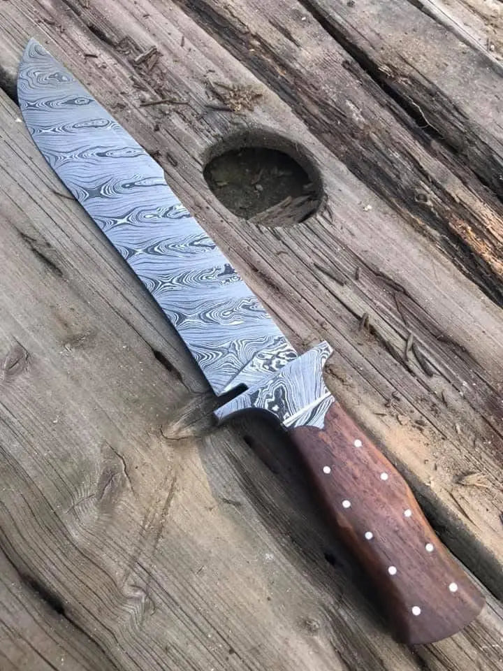 Wood handle with brass pins detail on Damascus bowie knife