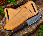 Dark wood handle detail on Damascus steel cowboy knife