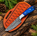 Handmade Damascus steel skinner knife with blue resin handle and raindrop pattern - full view