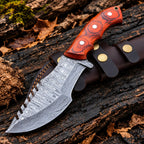 Handmade Damascus steel tracker knife with orange-red pakka wood handle, silver pins and horizontal leather sheath - full view