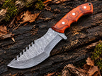 Damascus tracker knife blade with rippling pattern and saw-tooth spine - angle 2