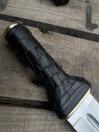 Brass guard and pommel detail on double edge dagger knife