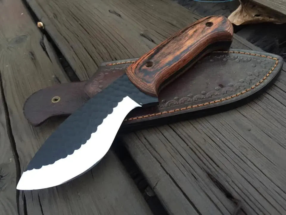 Hammered black hunting knife blade close-up
