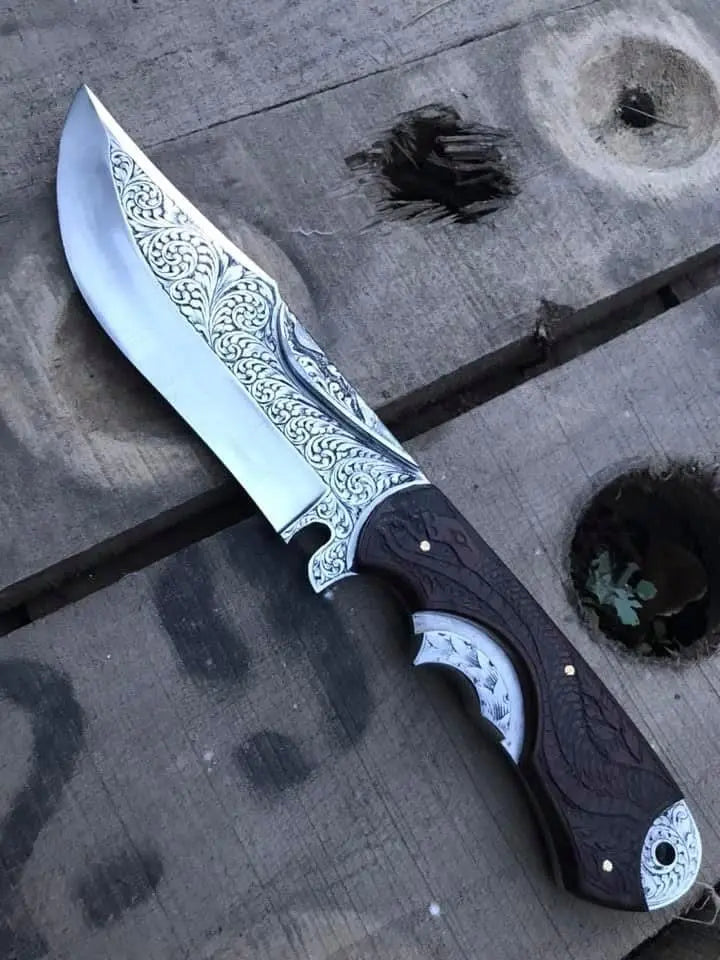 Scrollwork engraved blade close-up on Bowie skinner knife