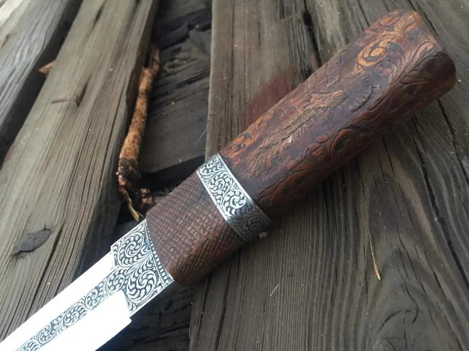 Carved wood handle with crosshatch grip detail on engraved knife