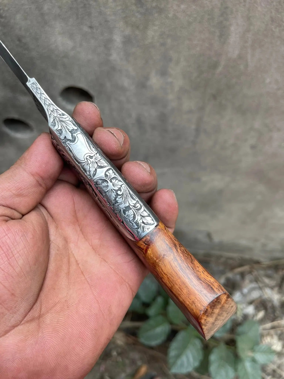 Floral engraving close-up on hand engraved fixed blade knife