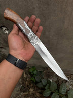 Carved silver bolster detail on hand engraved knife