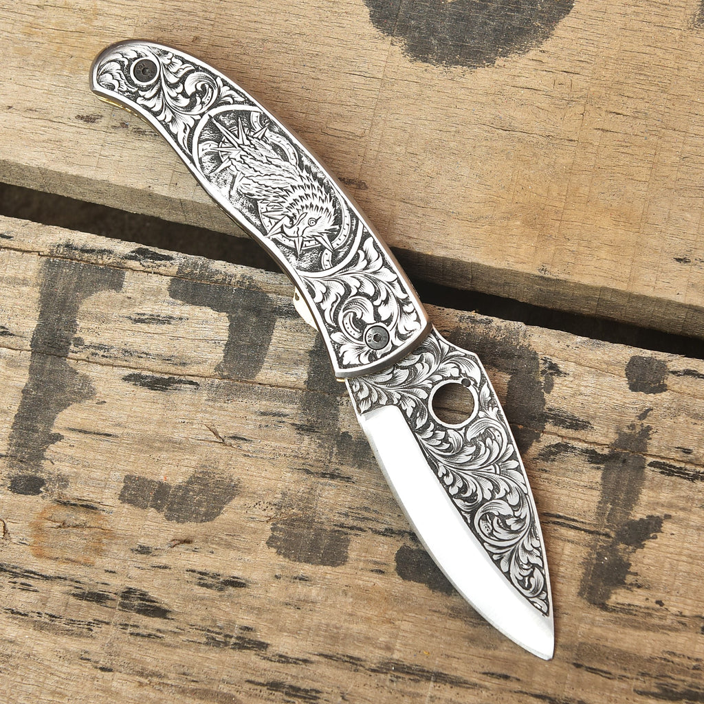 Hand engraved folding knife open, Damascus blade