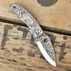 Hand engraved folding knife open, Damascus blade