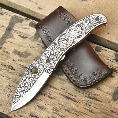 Close-up of hand engraved Damascus knife design